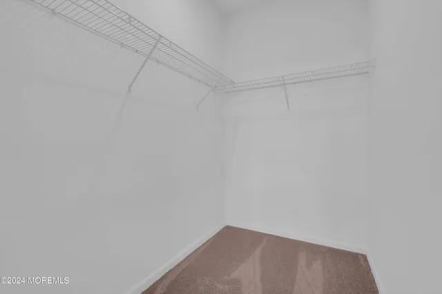 a view of an empty room and a window