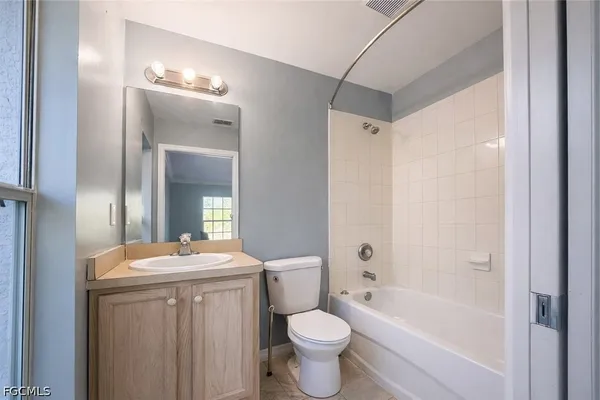 a bathroom with a toilet a sink and a bathtub