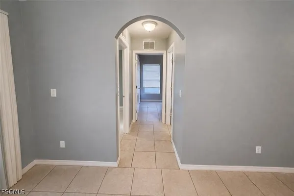 a view of a hallway view with a mirror