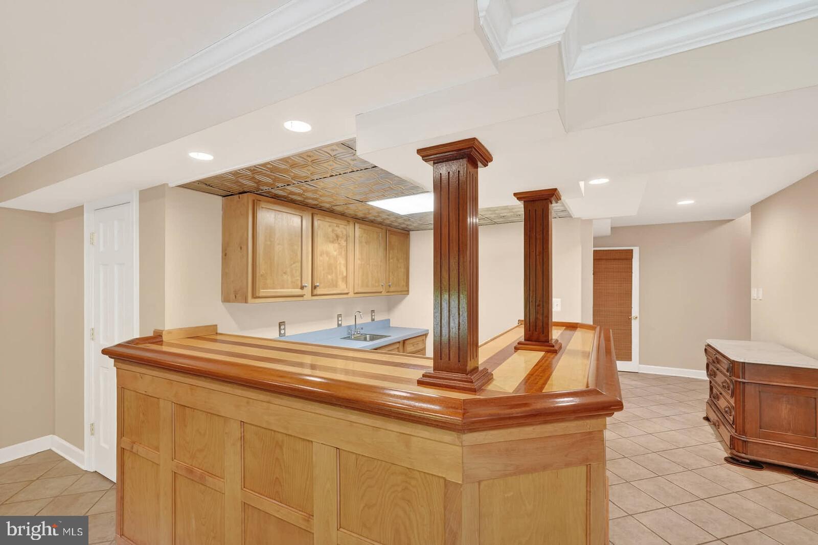 2108 Merrifields Drive Silver Spring, MD 20906 - Photo 46 of 69 a kitchen with kitchen island sink and large window