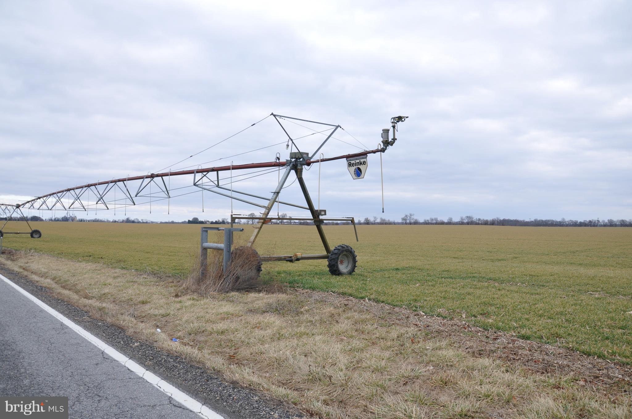 View with pivot irrigation covering 100 acres