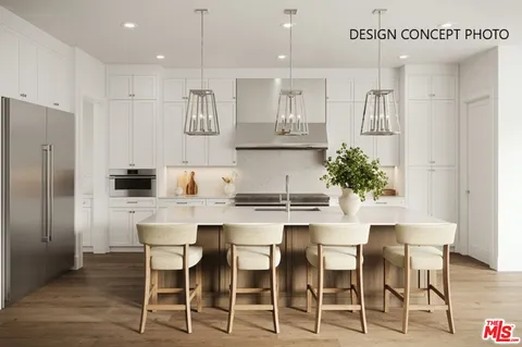 a kitchen with granite countertop white cabinets and stainless steel appliances