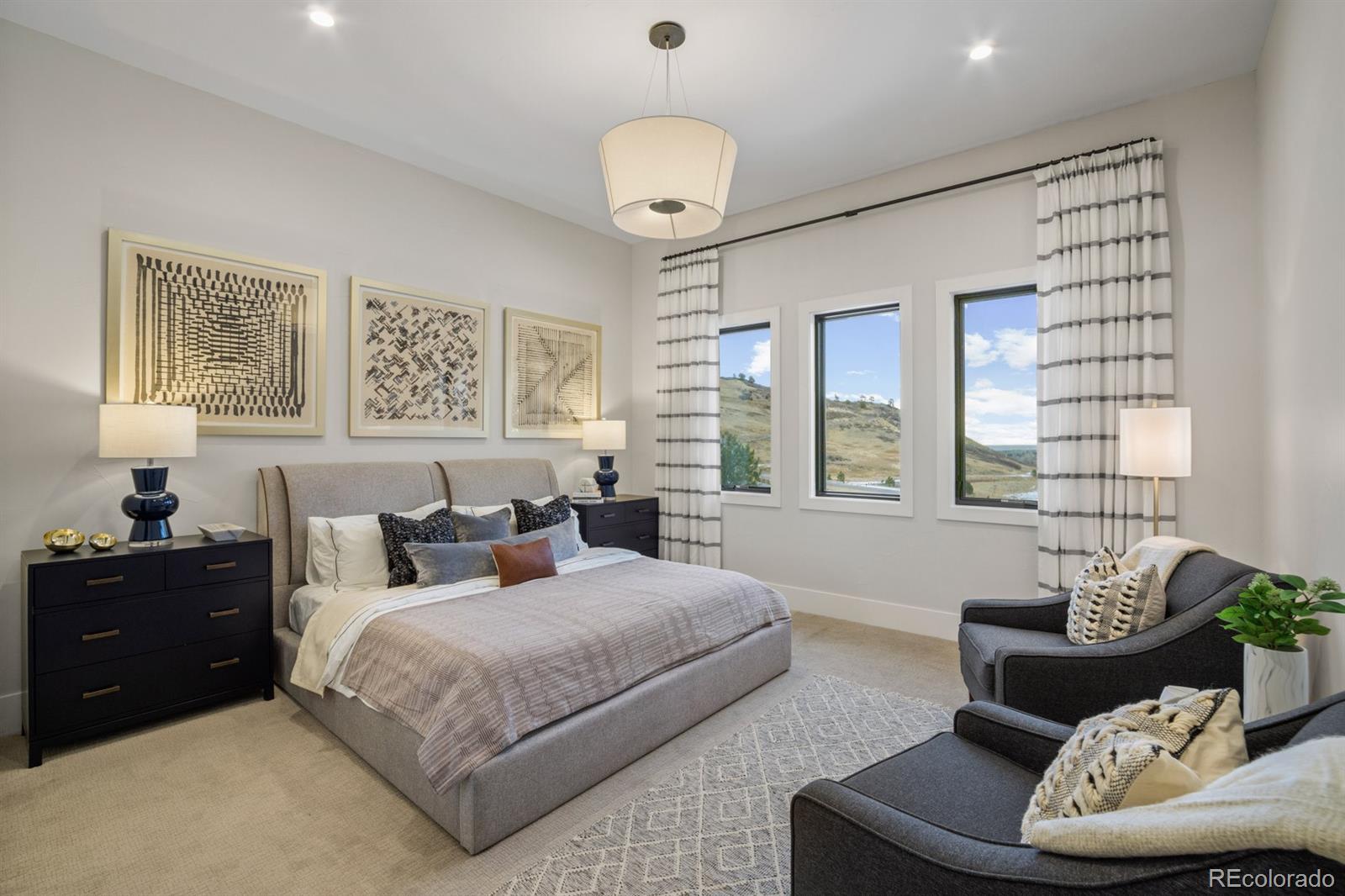 5132 Mount Glennon Way Morrison, CO 80465 - Photo 11 of 40 a bedroom with a bed and a couch