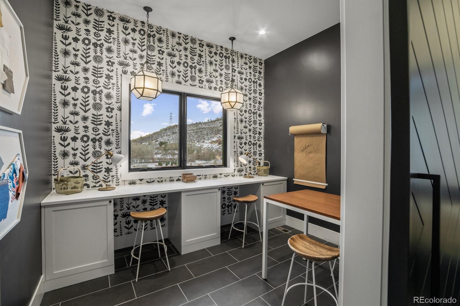 5132 Mount Glennon Way Morrison, CO 80465 - Photo 13 of 40 a kitchen with a sink and chairs