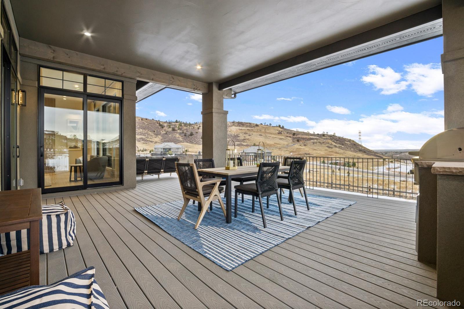 5132 Mount Glennon Way Morrison, CO 80465 - Photo 16 of 40 a view of a patio with table and chairs