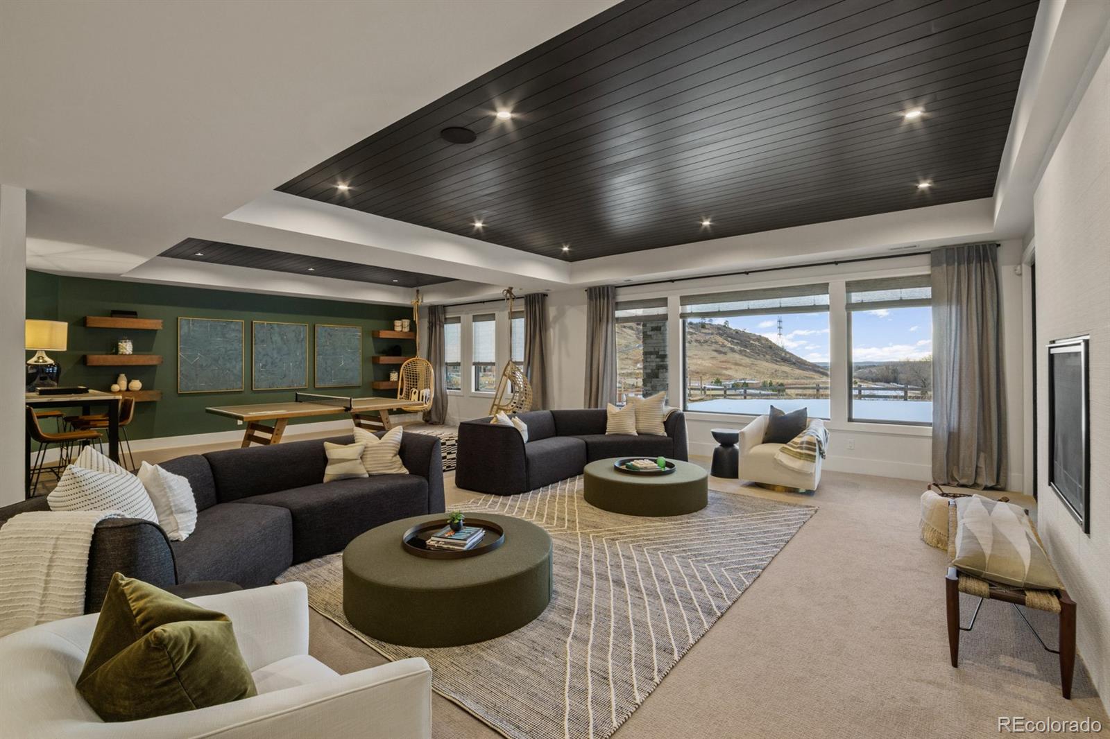 5132 Mount Glennon Way Morrison, CO 80465 - Photo 19 of 40 a living room with furniture and a large window