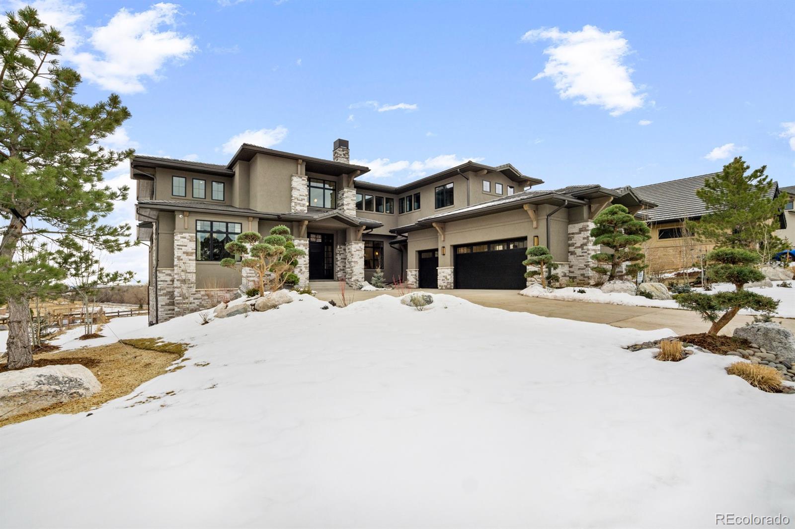 5132 Mount Glennon Way Morrison, CO 80465 - Photo 2 of 40 a front view of a house with a yard