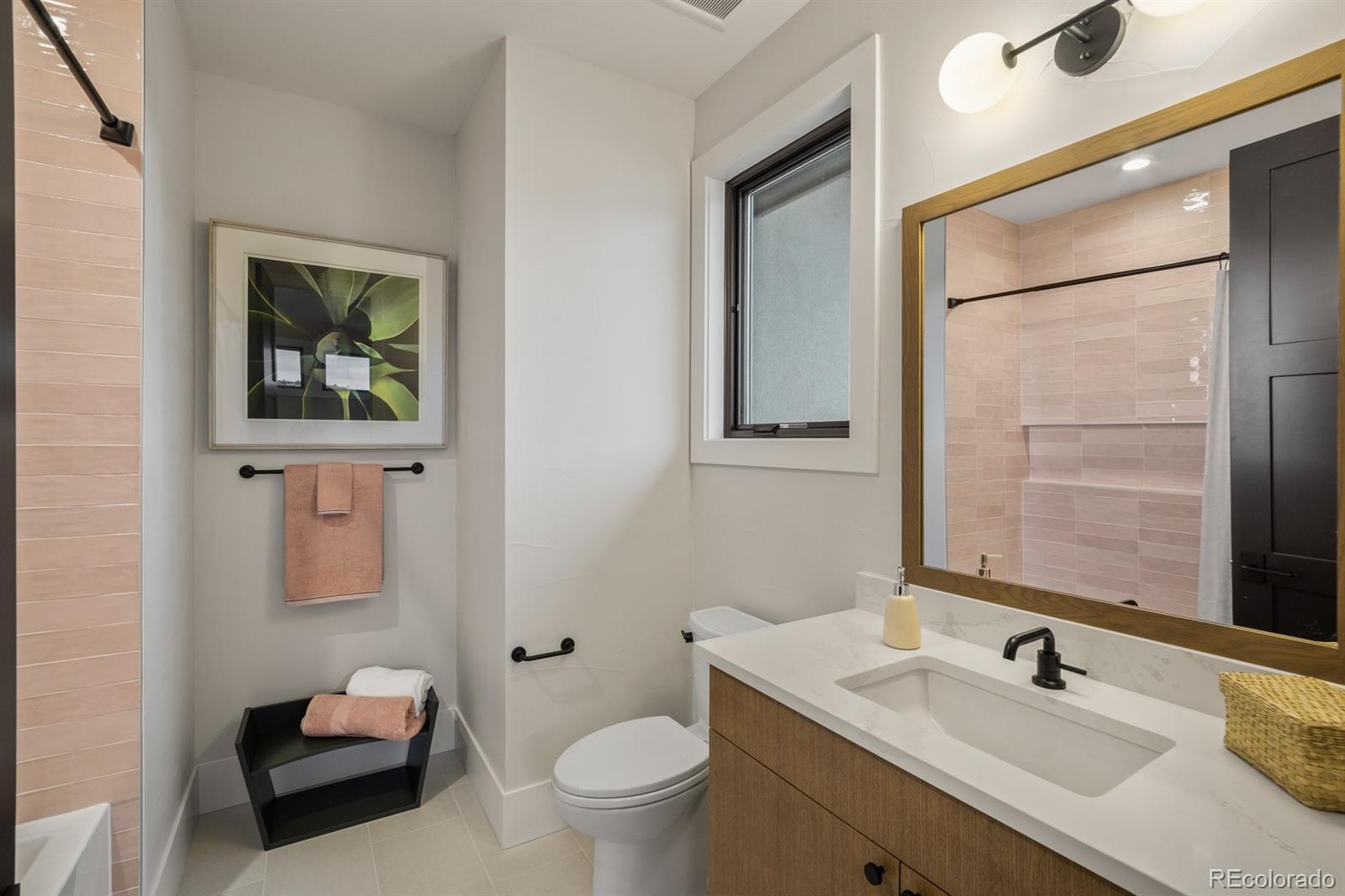 5132 Mount Glennon Way Morrison, CO 80465 - Photo 29 of 40 a bathroom with a sink toilet and mirror