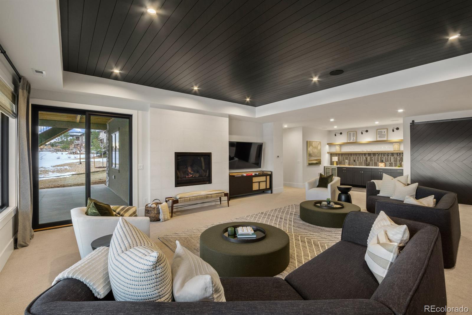 5132 Mount Glennon Way Morrison, CO 80465 - Photo 35 of 40 a living room with furniture and a flat screen tv