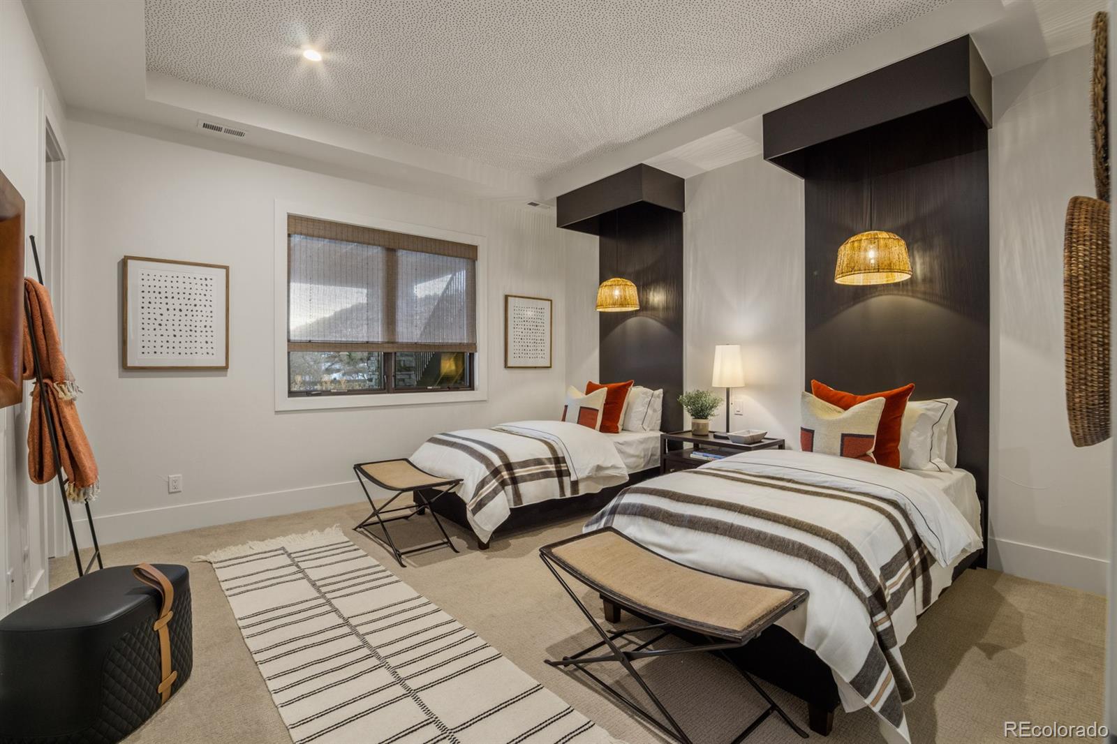 5132 Mount Glennon Way Morrison, CO 80465 - Photo 36 of 40 a bedroom with a bed and a mirror