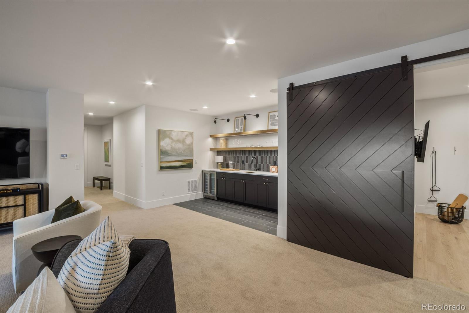 5132 Mount Glennon Way Morrison, CO 80465 - Photo 38 of 40 a living room with furniture and a kitchen