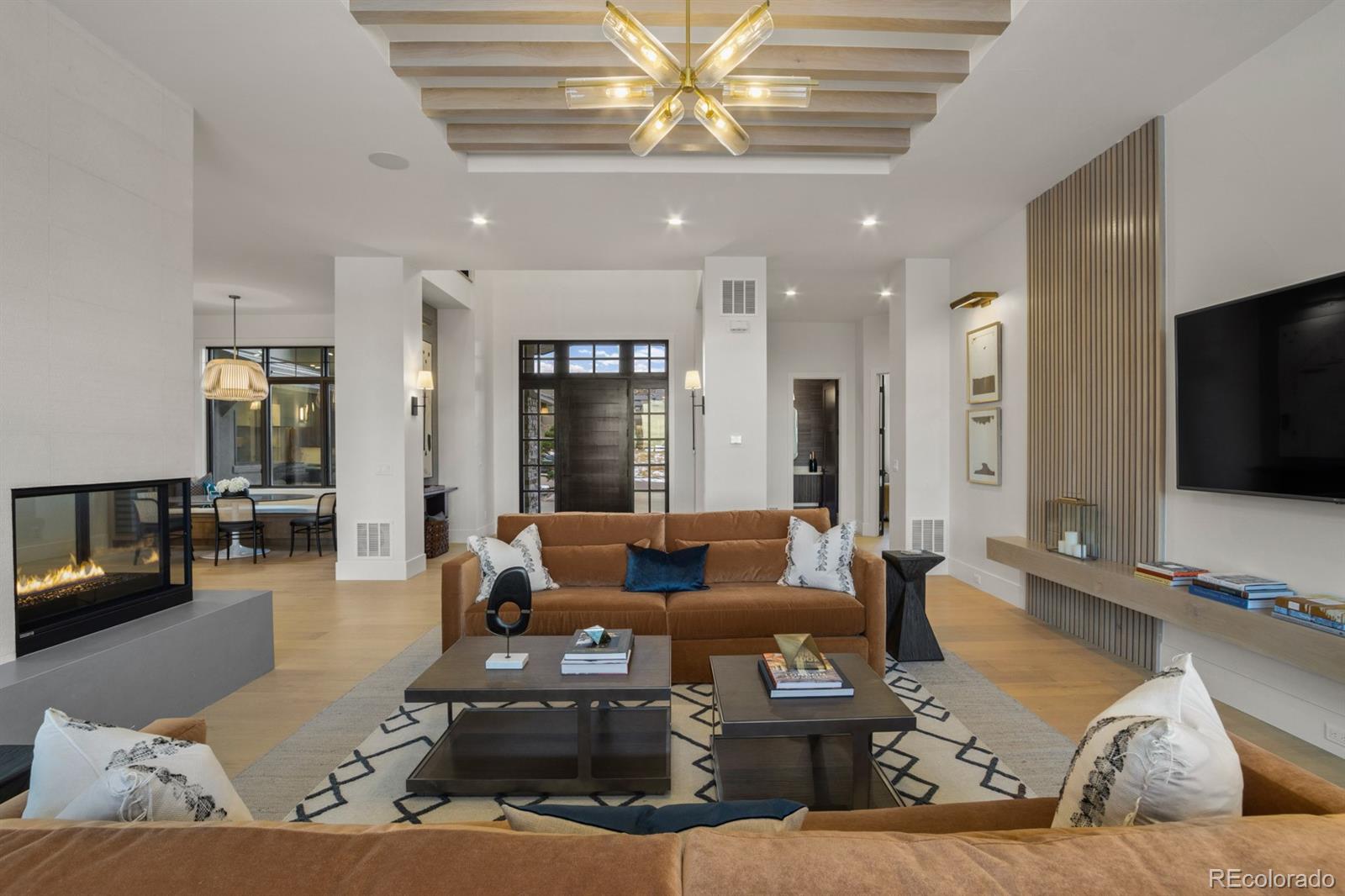 5132 Mount Glennon Way Morrison, CO 80465 - Photo 4 of 40 a living room with furniture and a flat screen tv