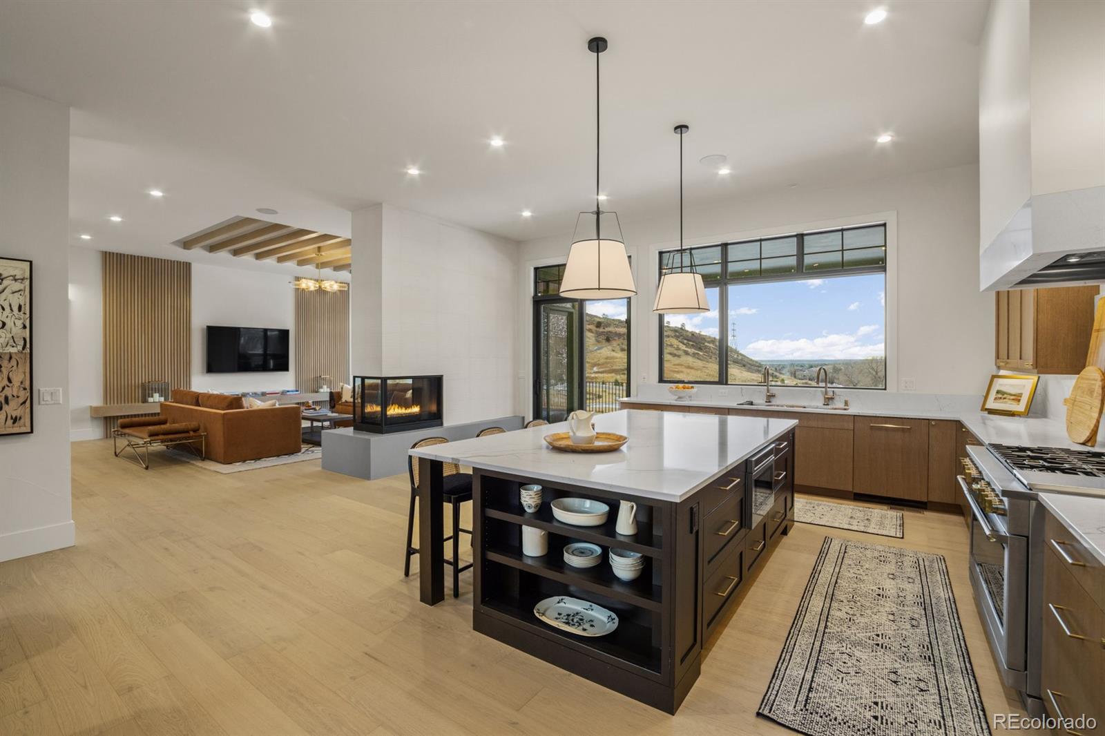 5132 Mount Glennon Way Morrison, CO 80465 - Photo 6 of 40 a kitchen with stainless steel appliances granite countertop a stove and a sink