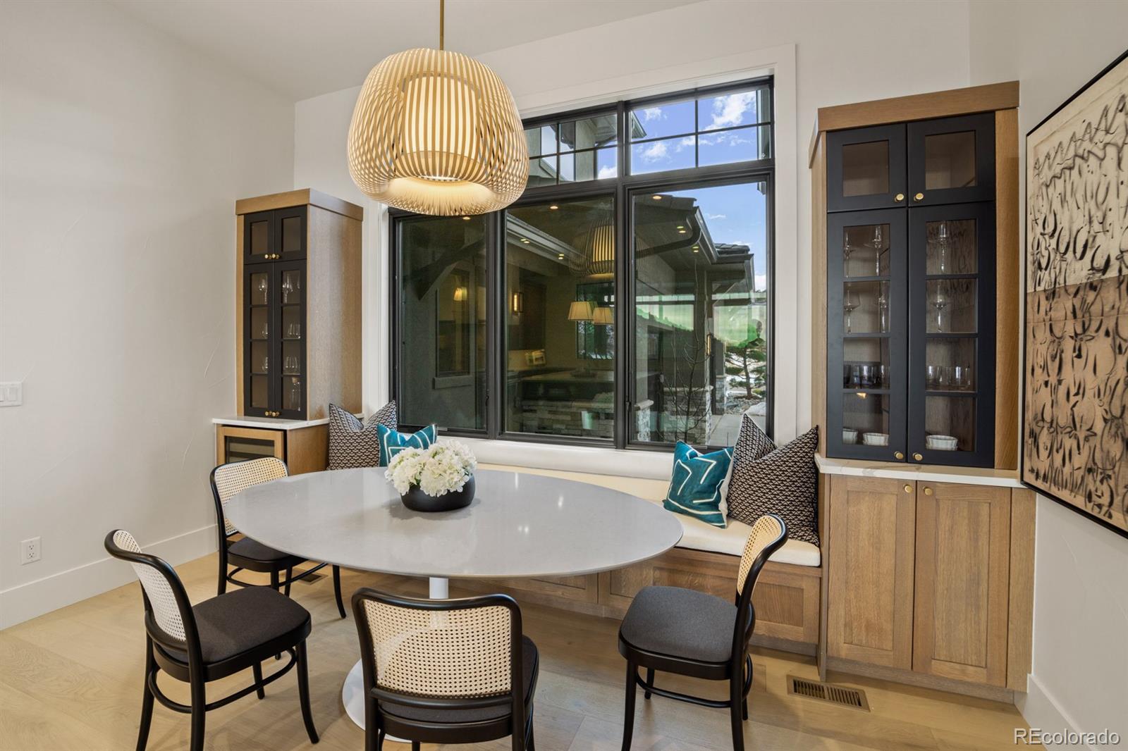 5132 Mount Glennon Way Morrison, CO 80465 - Photo 9 of 40 a view of a dining room with furniture wooden floor and chandelier