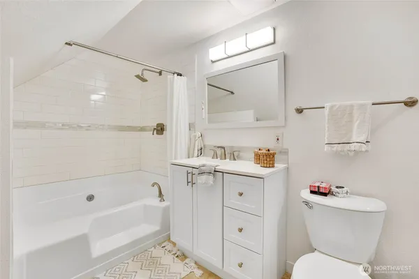 a bathroom with a sink a toilet and a bathtub