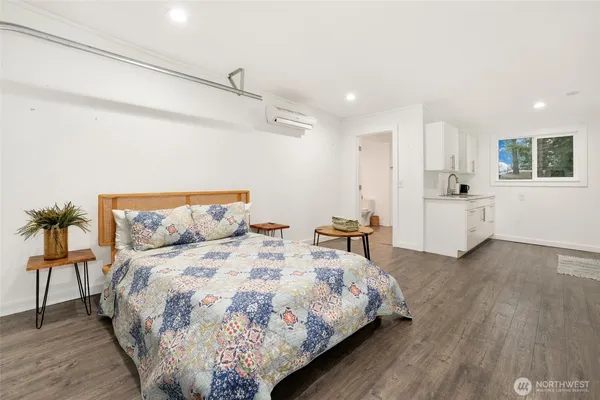 a bed room with a bed and a couch
