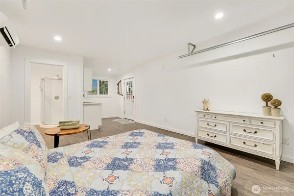 a bed room with a bed and a dresser