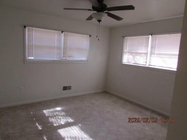 608 West Ave J Muleshoe, TX 79347 - Photo 17 of 25 en empty room with windows