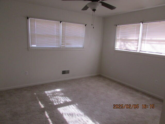 608 West Ave J Muleshoe, TX 79347 - Photo 19 of 25 an empty room with a window