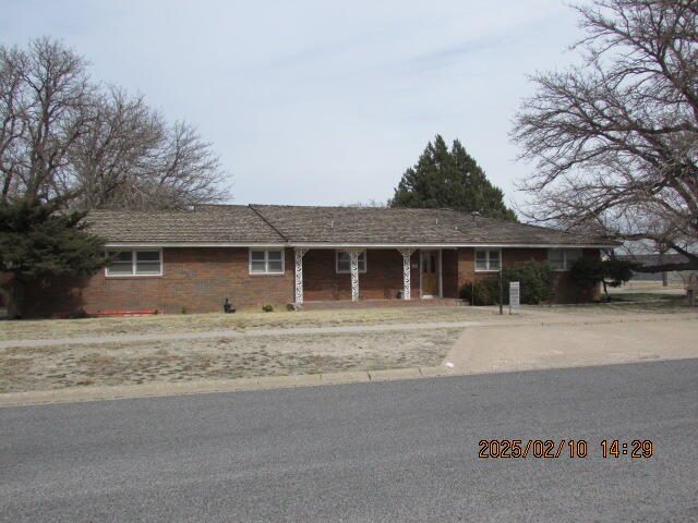 608 West Ave J Muleshoe, TX 79347 - Photo 24 of 25 a front view of a house with a garden