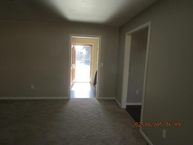 608 West Ave J Muleshoe, TX 79347 - Photo 8 of 25 a view of an empty room and a window