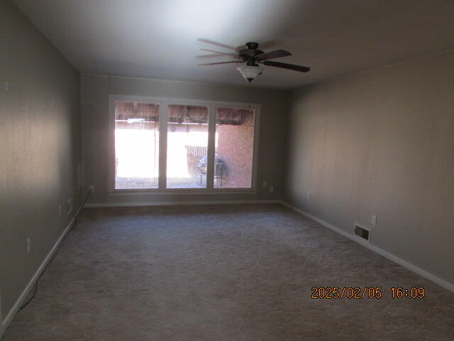608 West Ave J Muleshoe, TX 79347 - Photo 9 of 25 an empty room with a window