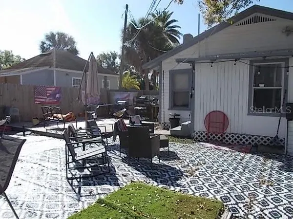 a view of a backyard of the house