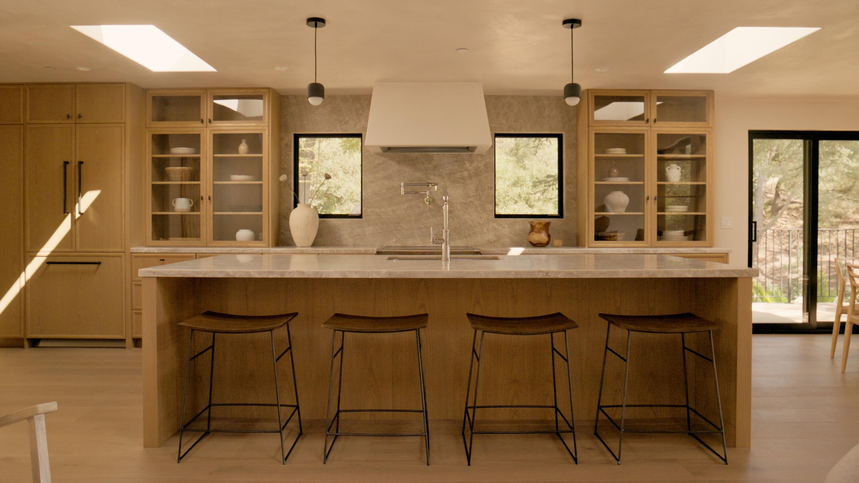 1590 San Roque Road Santa Barbara, CA 93105 - Photo 13 of 63 a kitchen with granite countertop a table chairs and a chandelier