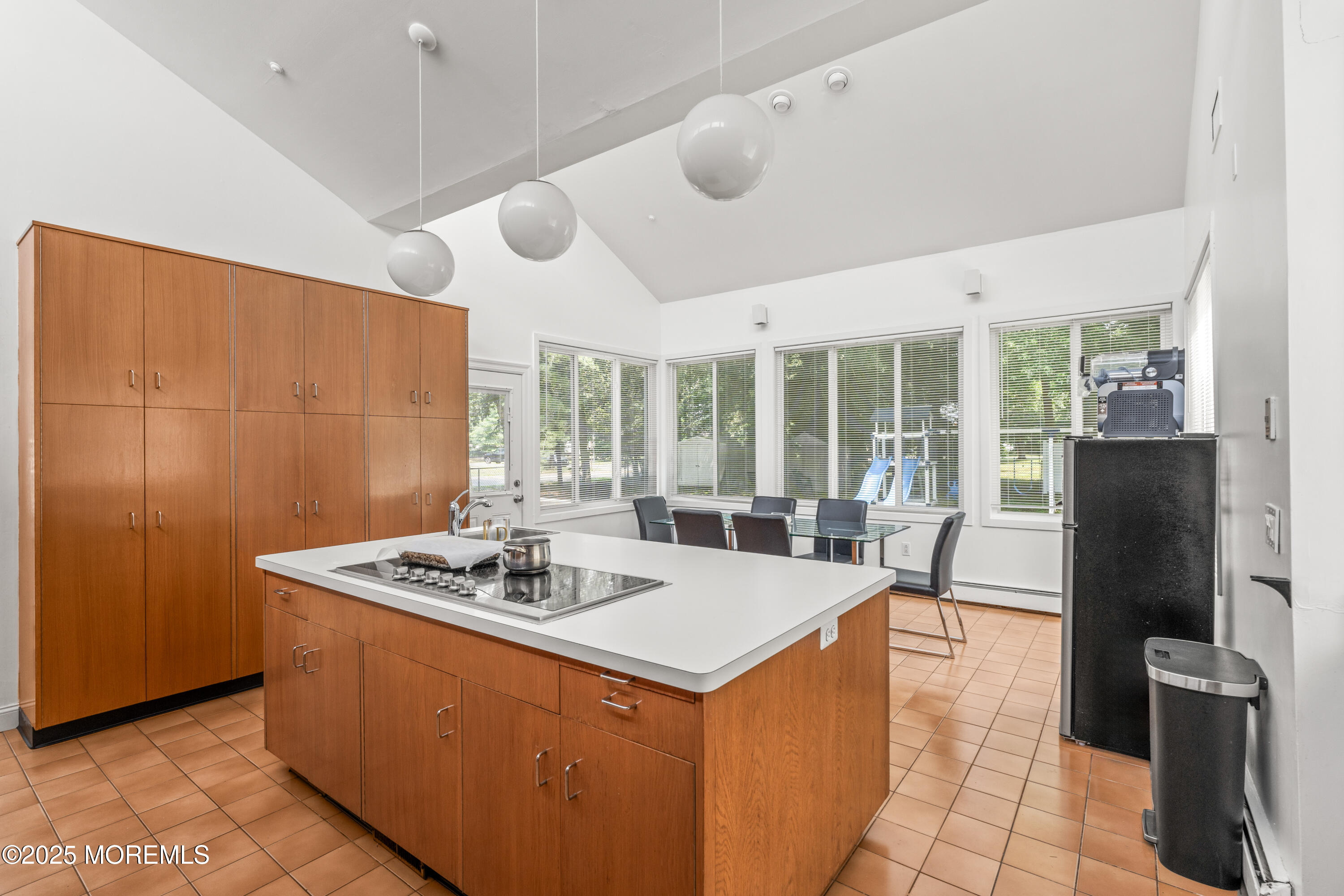 460 Runyan Avenue Deal, NJ 07723 - Photo 11 of 30 a dining hall with granite countertop a stove and refrigerator