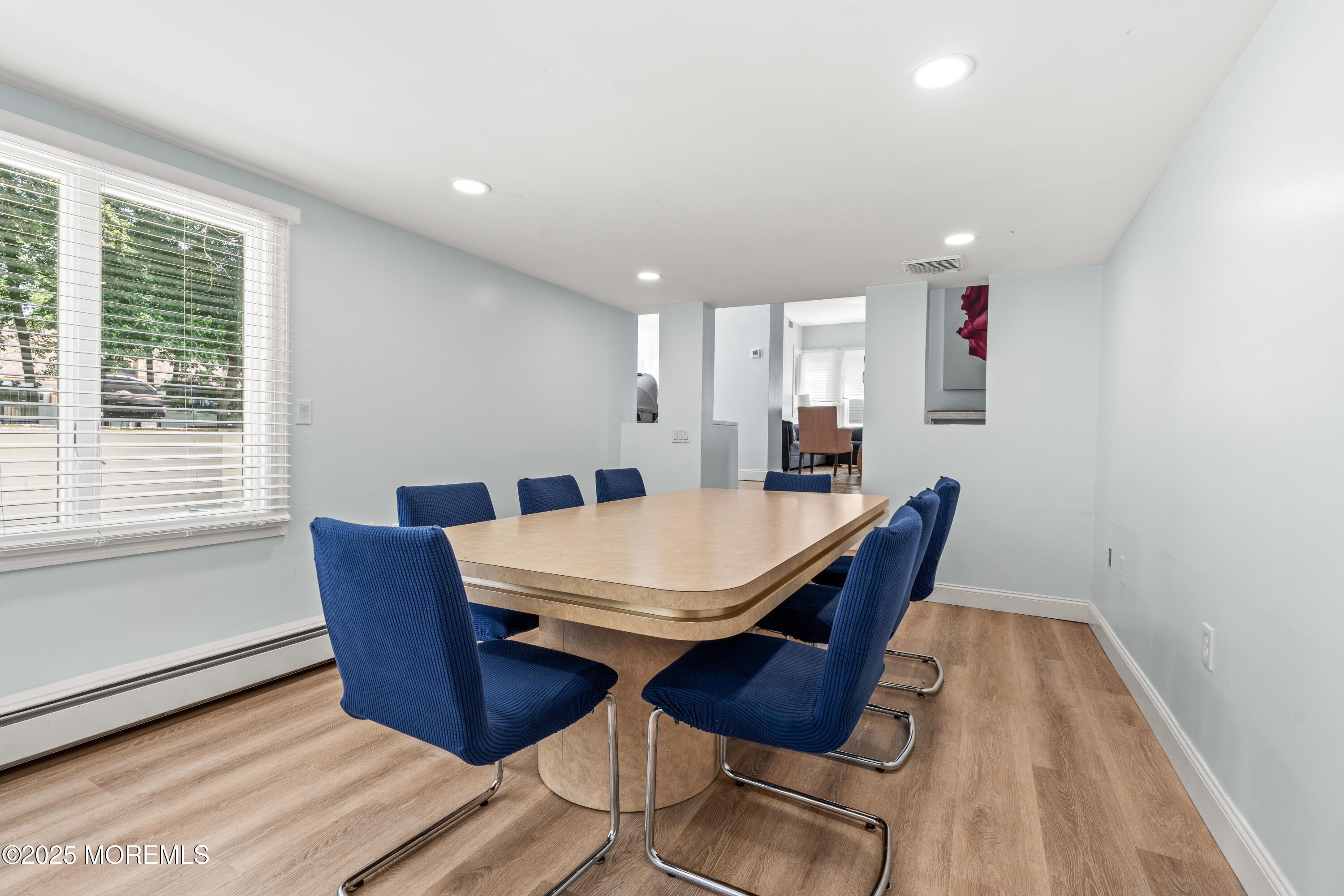 460 Runyan Avenue Deal, NJ 07723 - Photo 16 of 30 a view of a dining room with furniture window and wooden floor