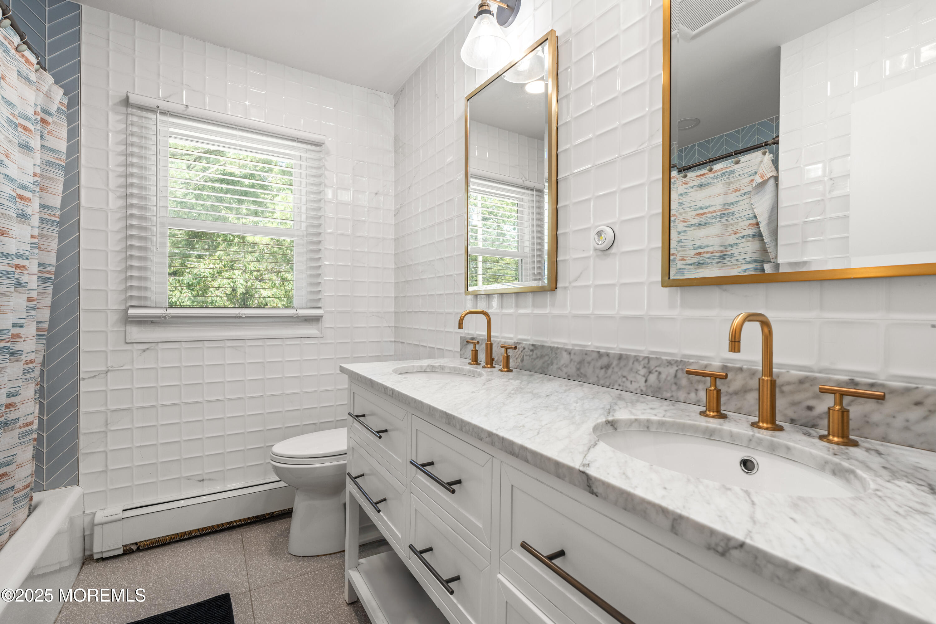 460 Runyan Avenue Deal, NJ 07723 - Photo 24 of 30 a bathroom with a granite countertop toilet sink and mirror