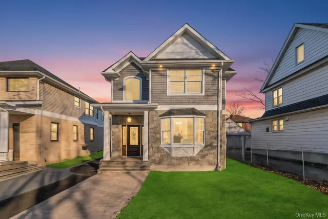 a front view of a house with a yard