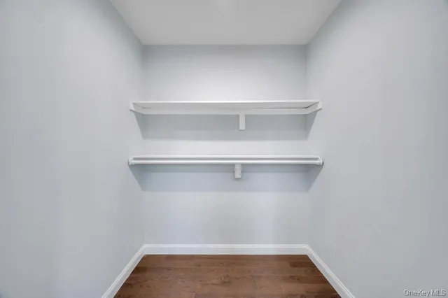 a view of an empty room with stairs