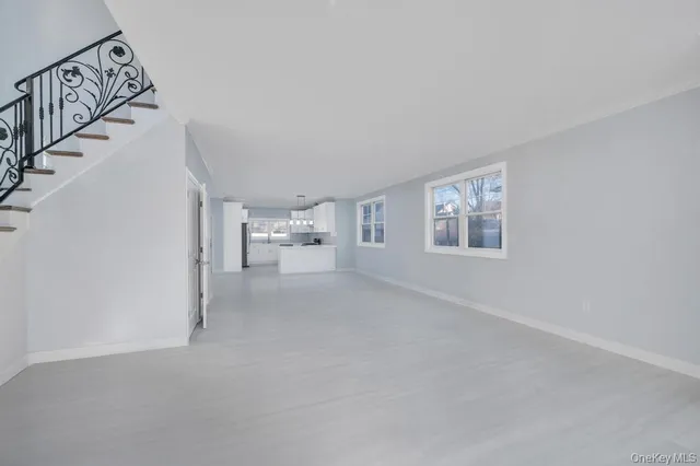 a view of empty room with fireplace