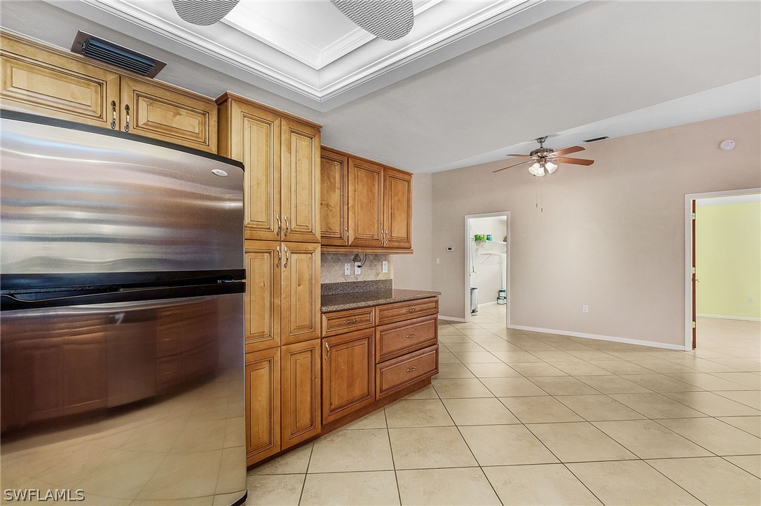 17516 Ingram Road Fort Myers, FL 33967 - Photo 13 of 26 a kitchen with a stove a sink and a refrigerator