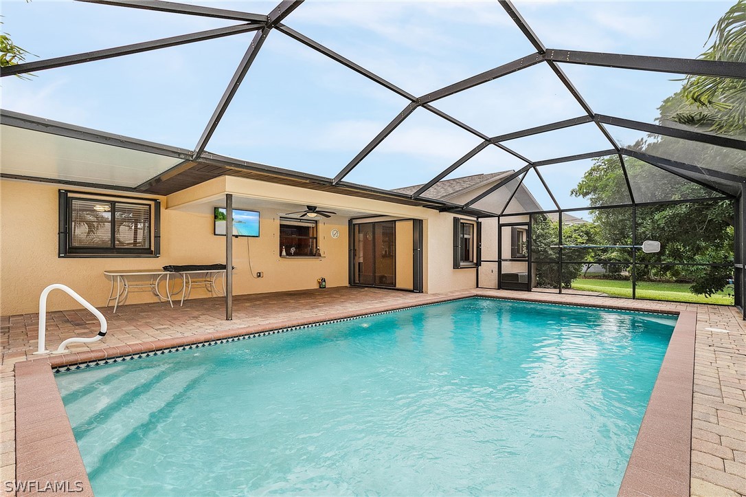 17516 Ingram Road Fort Myers, FL 33967 - Photo 3 of 26 a swimming pool with outdoor seating and yard