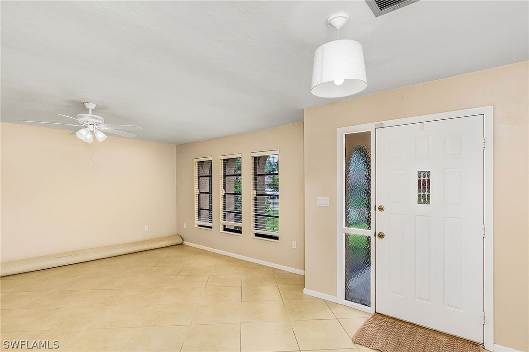 17516 Ingram Road Fort Myers, FL 33967 - Photo 6 of 26 a view of an empty room with a window
