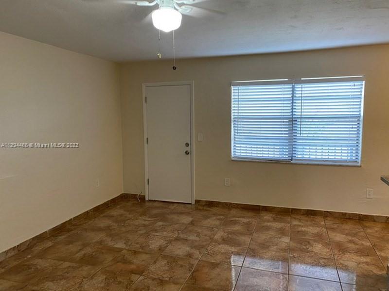 Glenvar Heights Miami, FL 33155 - Photo 5 of 12 an empty room with a window
