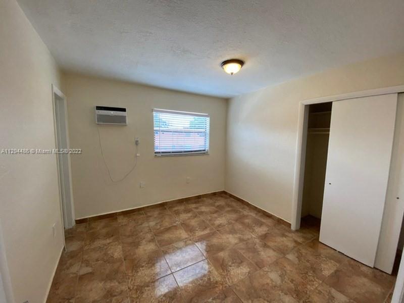 Glenvar Heights Miami, FL 33155 - Photo 8 of 12 an empty room with windows