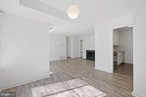 a view of a kitchen with a sink and a stove