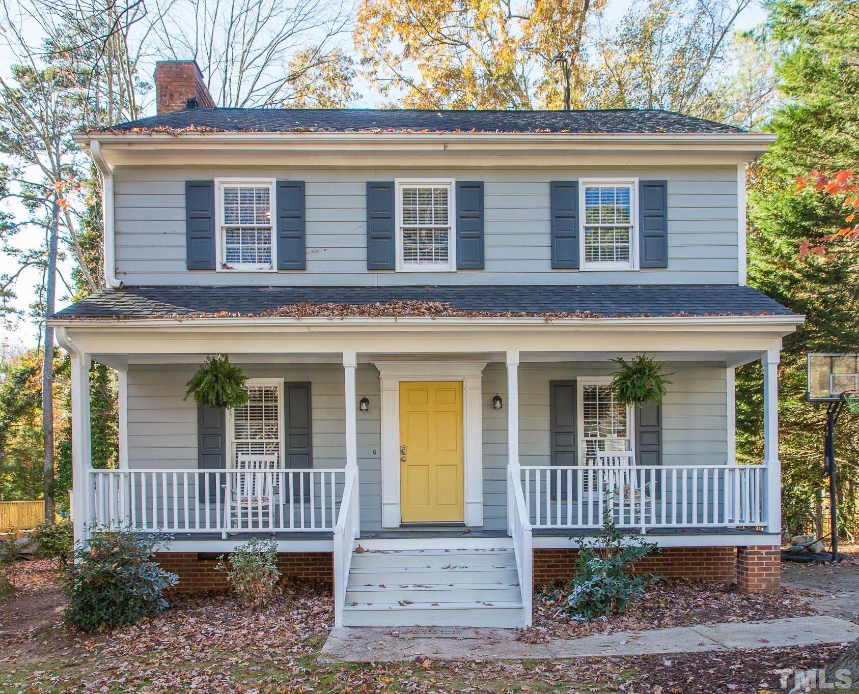 7013 Sandringham Drive Raleigh, NC 27613 - Photo 1 of 25 a front view of a house with a garden