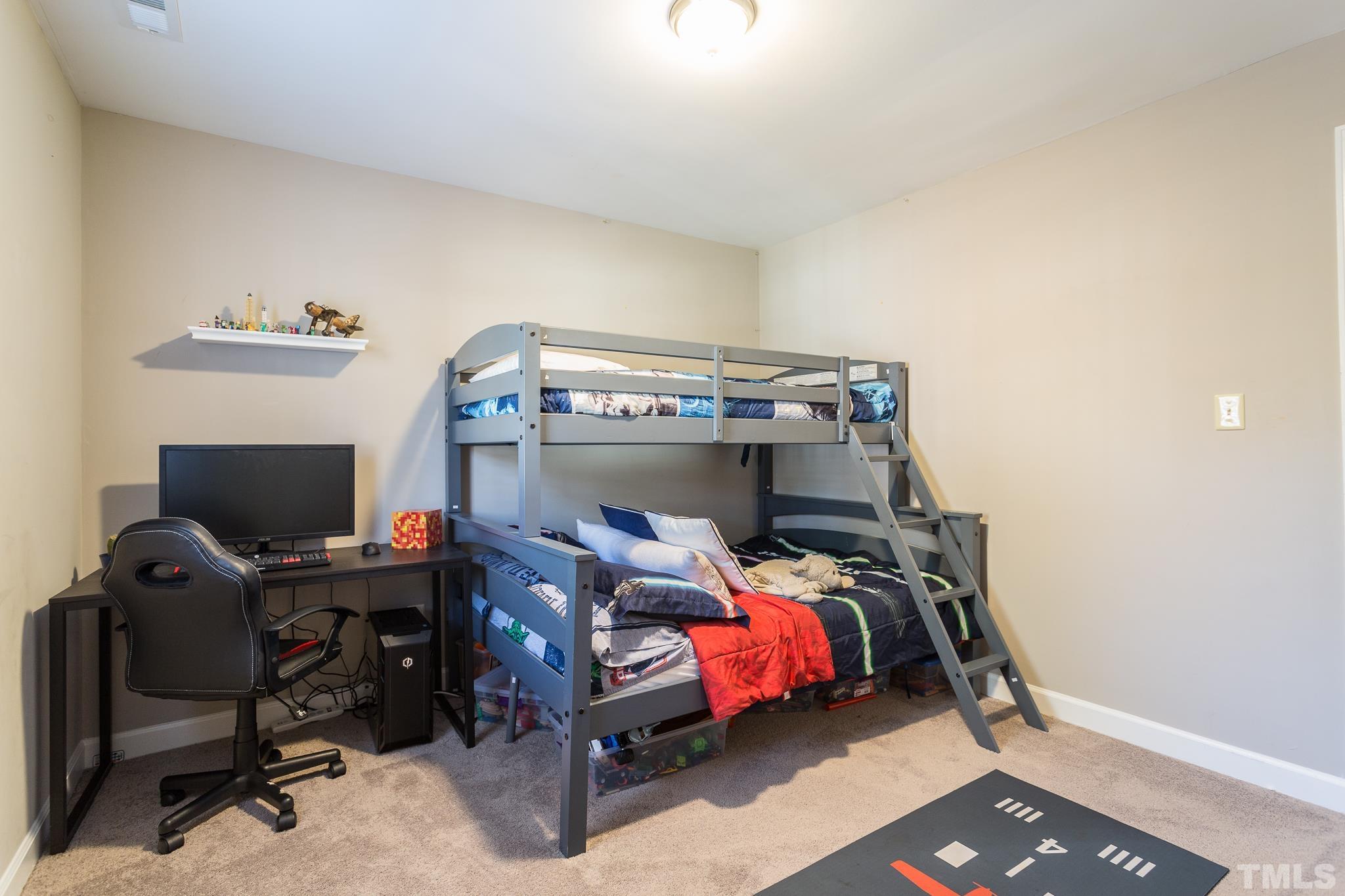 7013 Sandringham Drive Raleigh, NC 27613 - Photo 13 of 25 a bedroom with a bunk bed and a desk