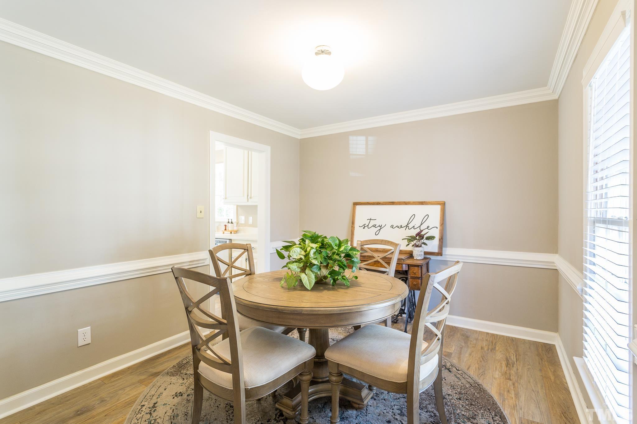 7013 Sandringham Drive Raleigh, NC 27613 - Photo 5 of 25 a view of a dining room with furniture and window