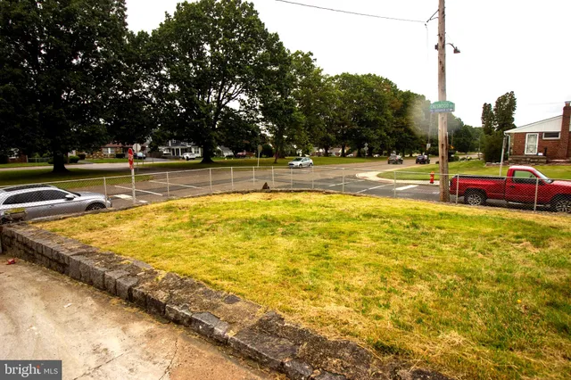 a swimming pool with outdoor seating and yard