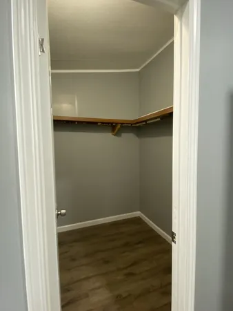 a view of an empty walk in closet