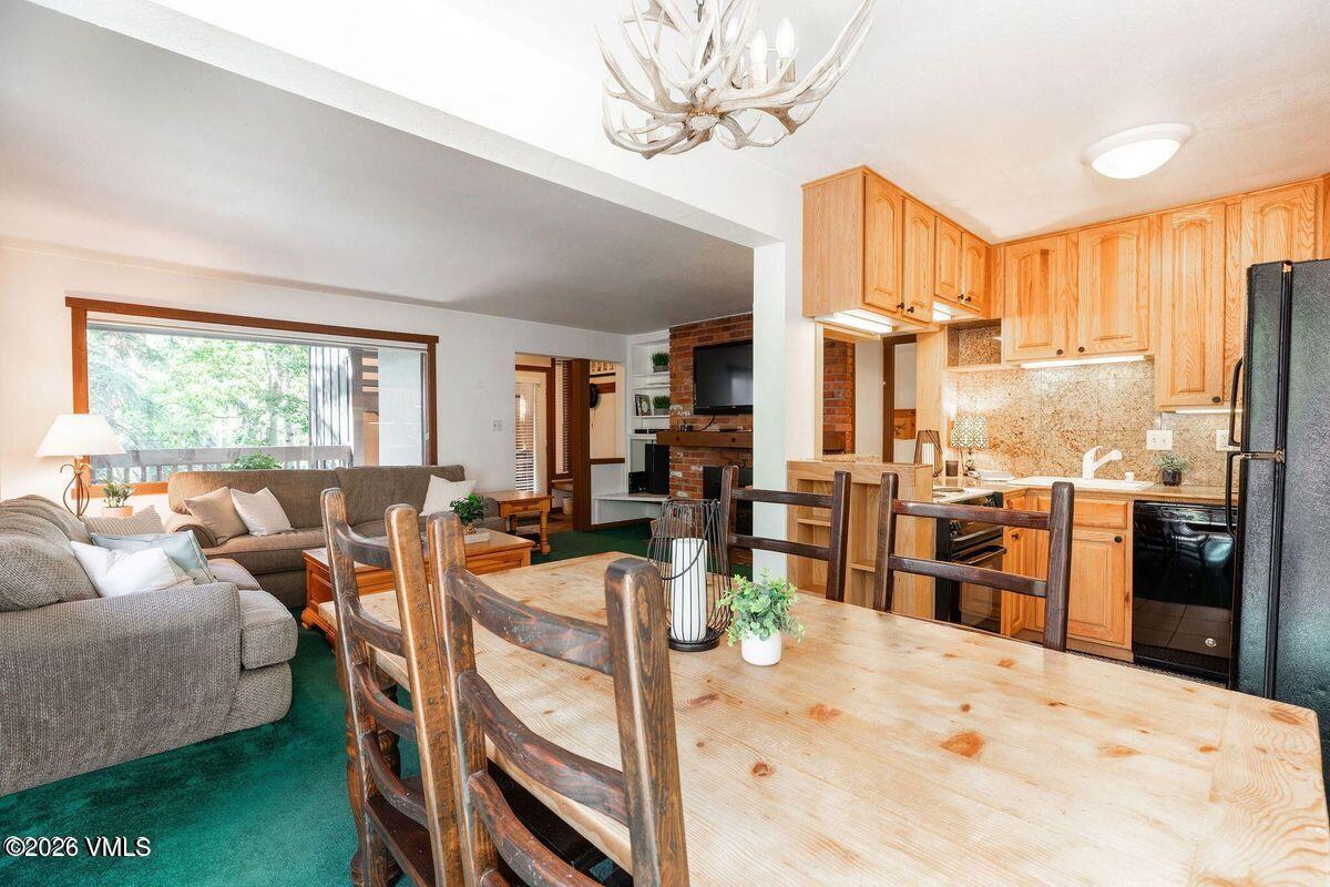 4600 Vail Racquet Club Drive, Unit 610 Vail, CO 81657 - Photo 2 of 26 a view of a living room kitchen and a large window
