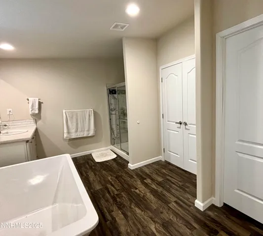 a living room with a bed and furniture