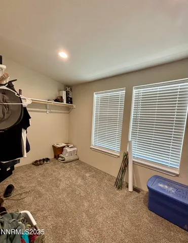 a room with gym equipment and a window