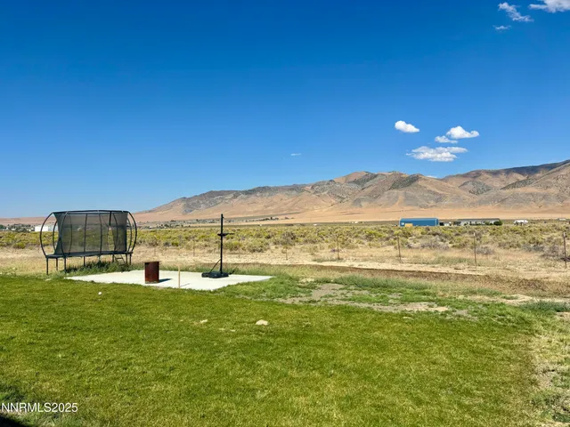 a view of a big room with table and chairs