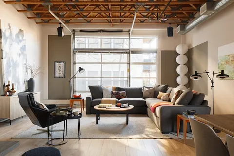 a living room with furniture and a window